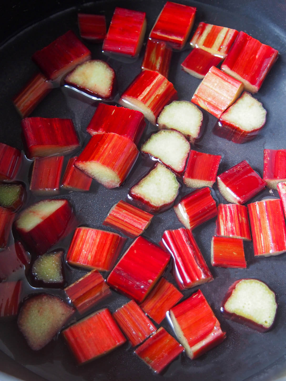 pieces of rhubarb in water in pan