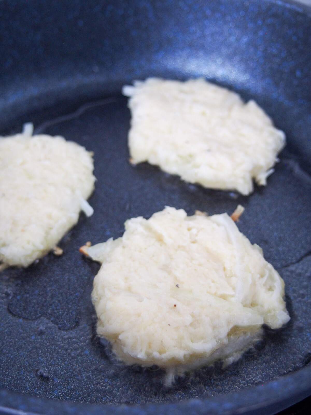 frying three pancakes in skillet