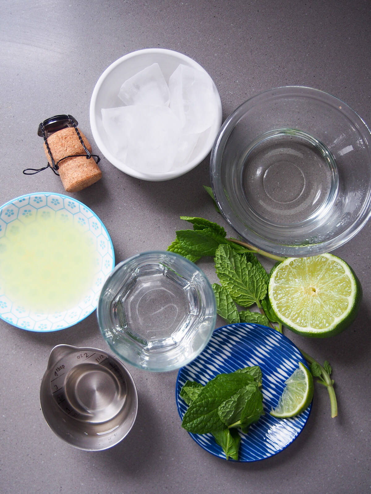 bowls with lime juice, mint, ice, simple syrup and rum