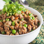 bowl of keema curry garnished with cilantro