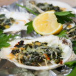 Oysters Rockefeller with lemon slice behind