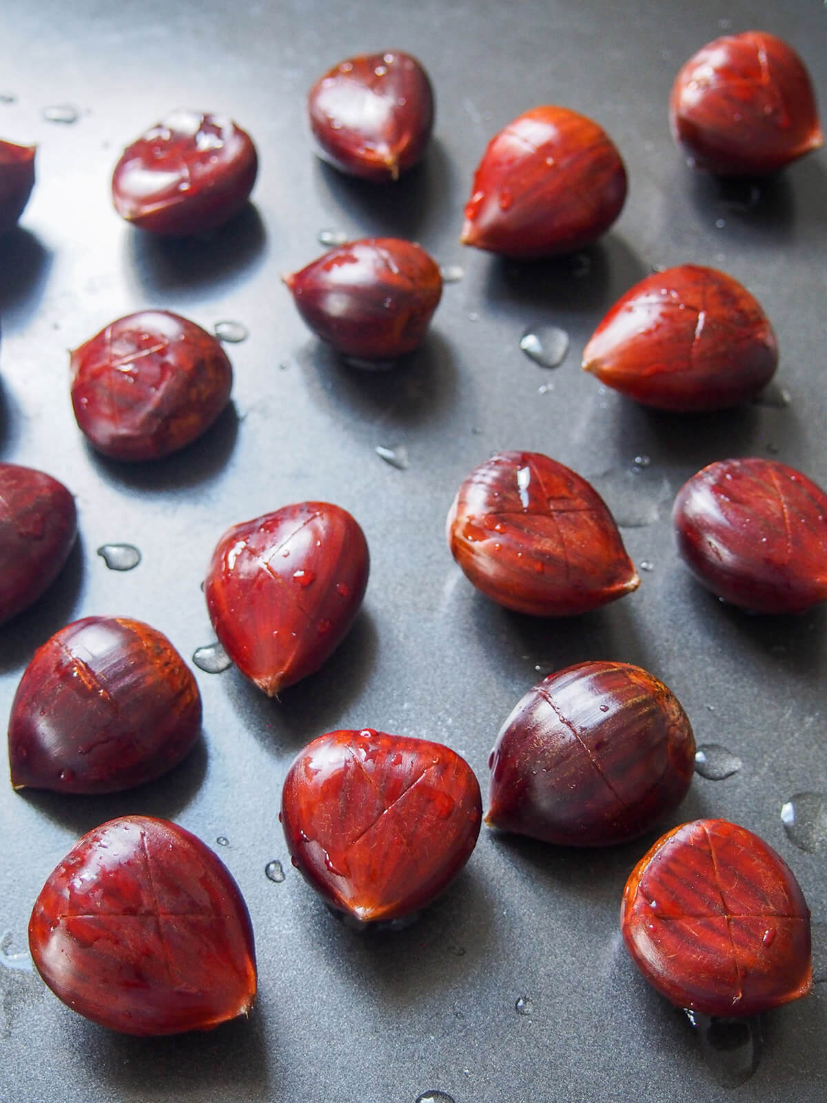 scored washed chestnuts before roasting