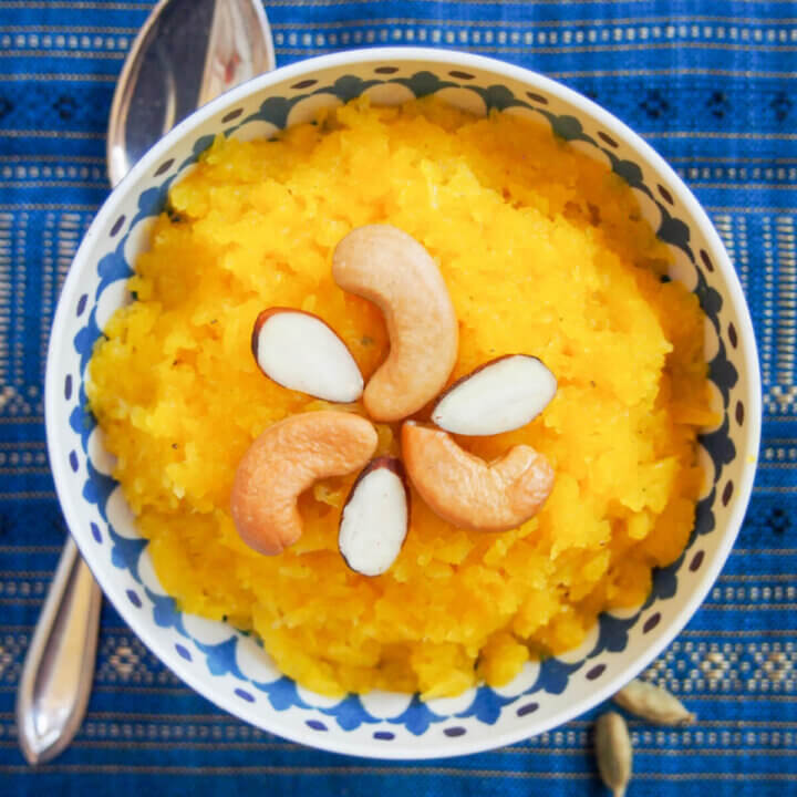 bowl of pumpkin halwa with spoon under bowl