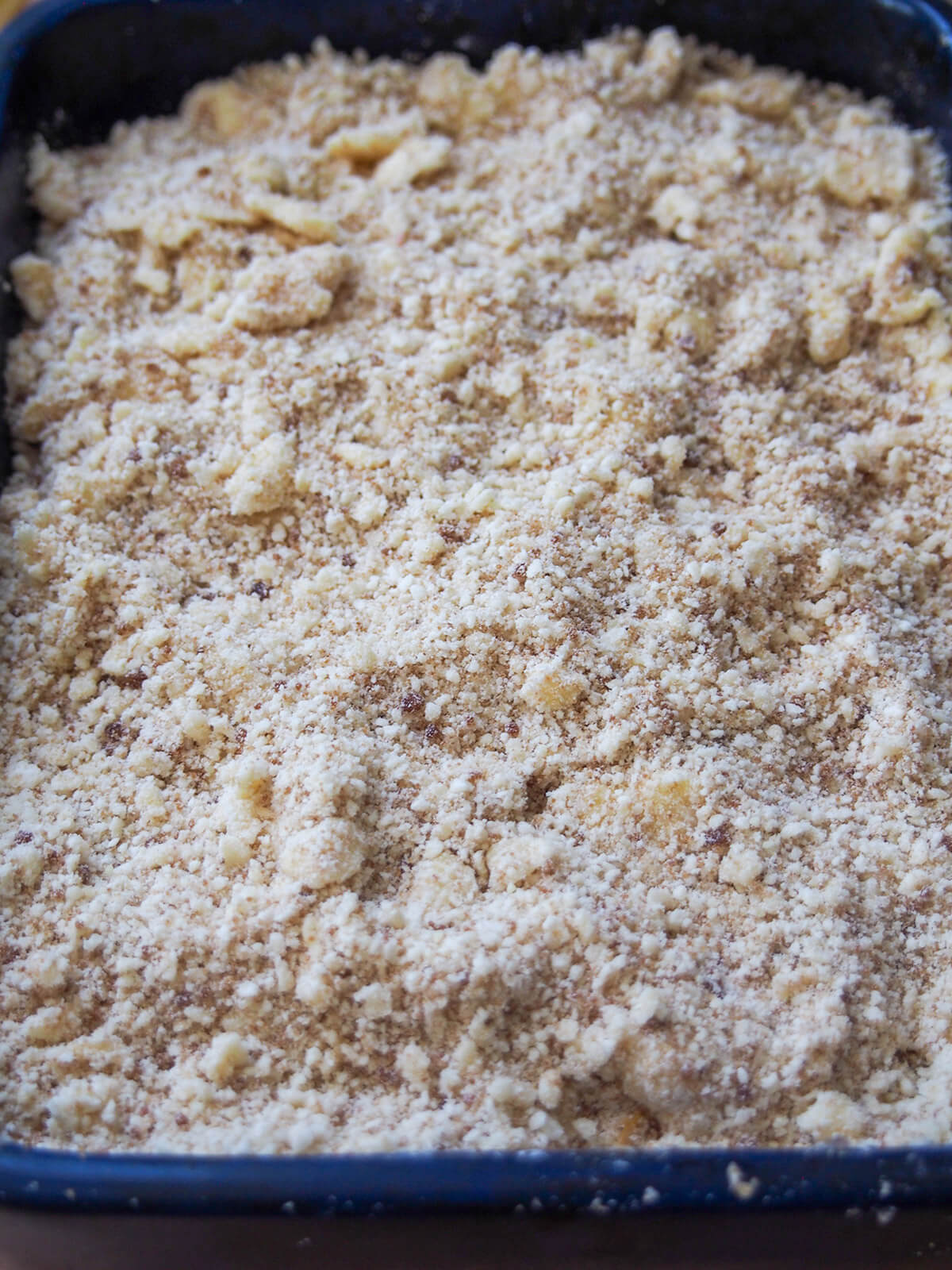 crumble topping over plums before baking