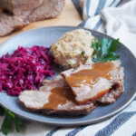 plate of Schweinebraten - German pork roast with red cabbage and dumpling