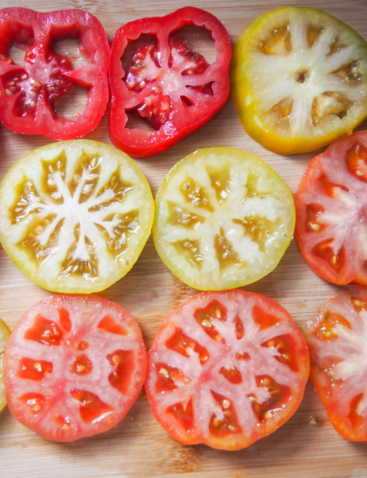 slices of tomato laid out on board