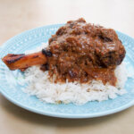 slow cooker lamb rogan josh shank over rice