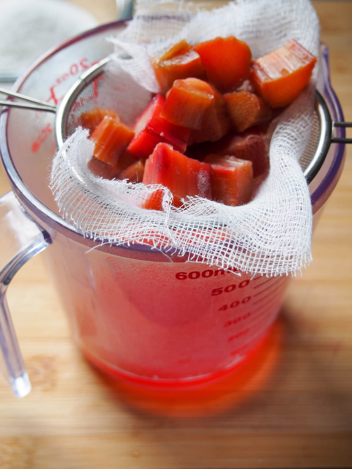 straining pieces of rhubarb