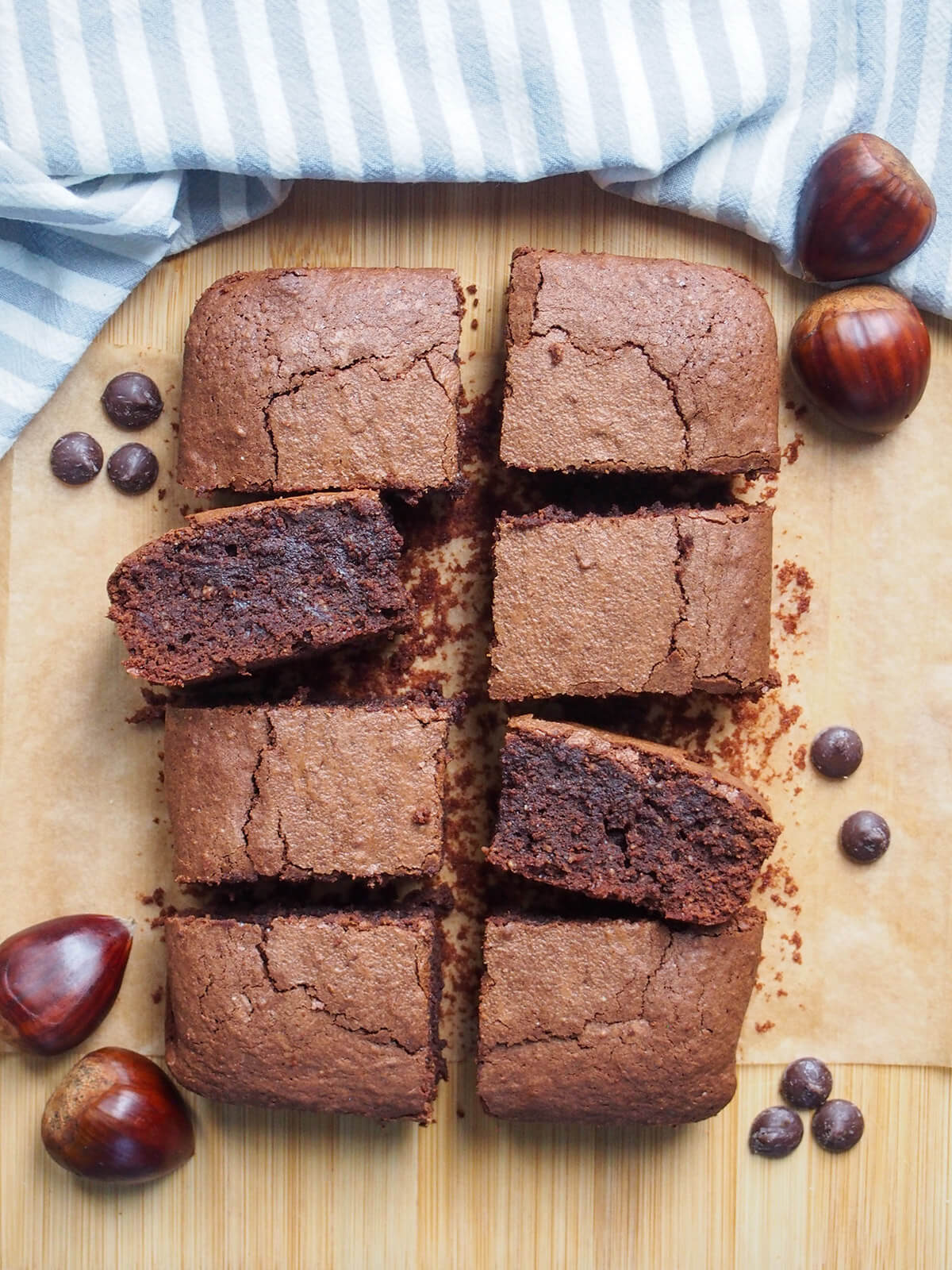chestnut brownies on board with two turned on side and chestnuts to side