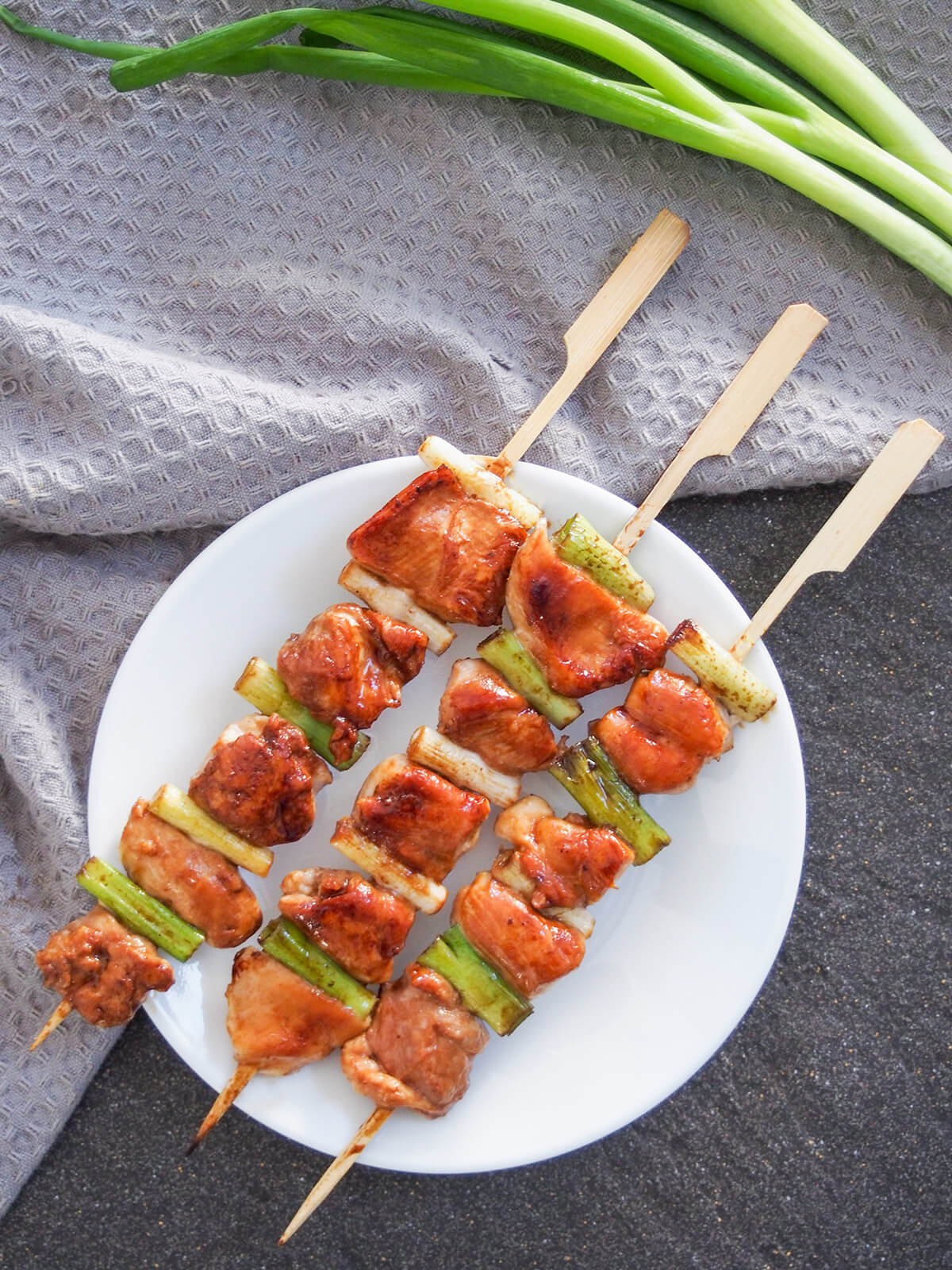 plate of chicken yakitori skewers from overhead