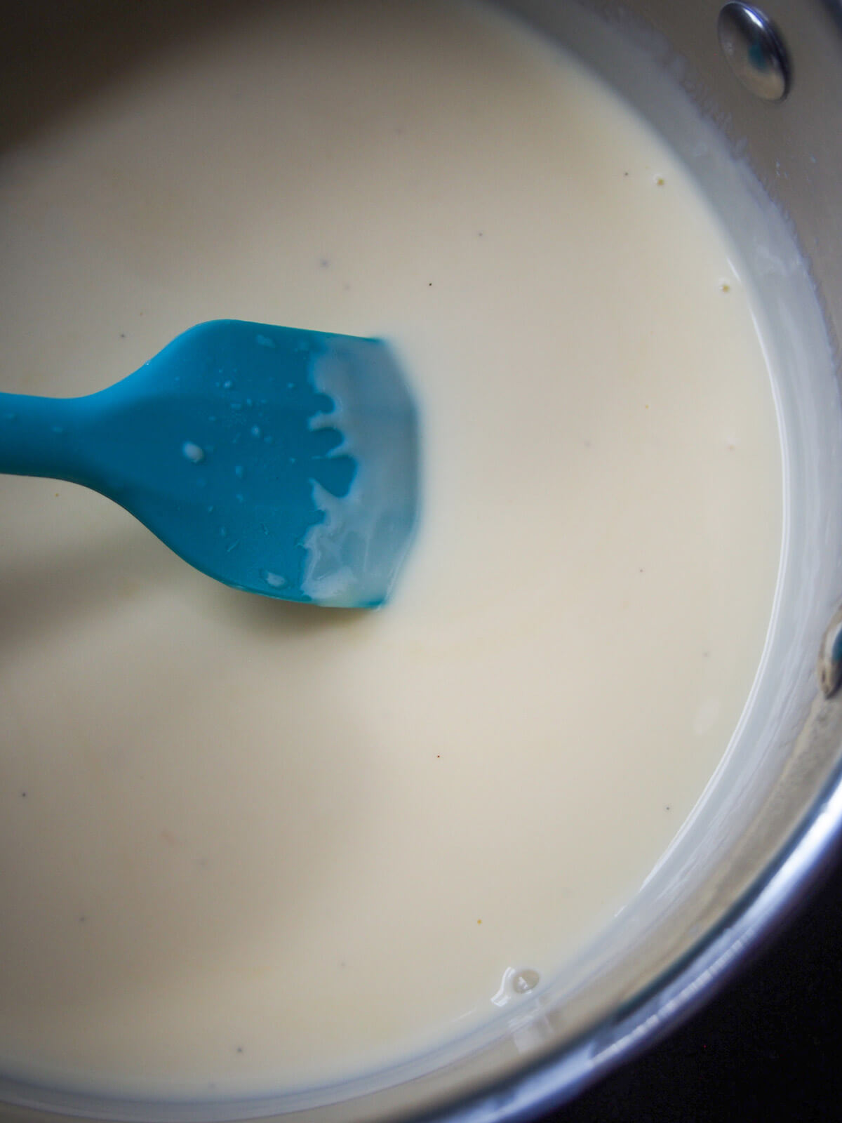 stirring milk and yolk mixture to thicken it