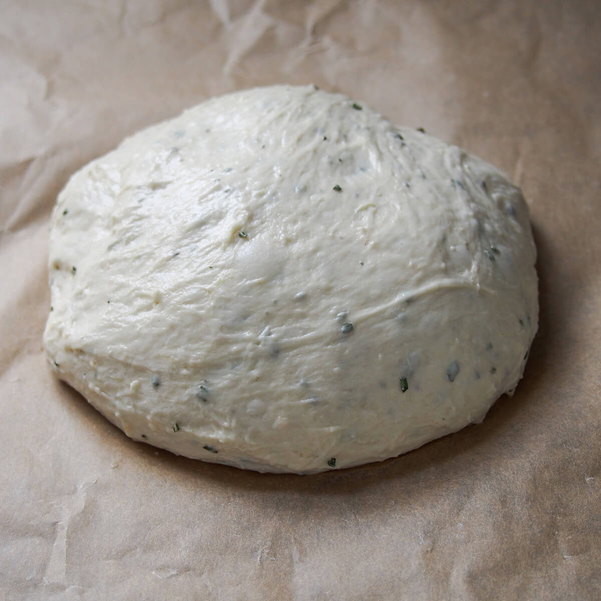 formed loaf on parchment paper before baking