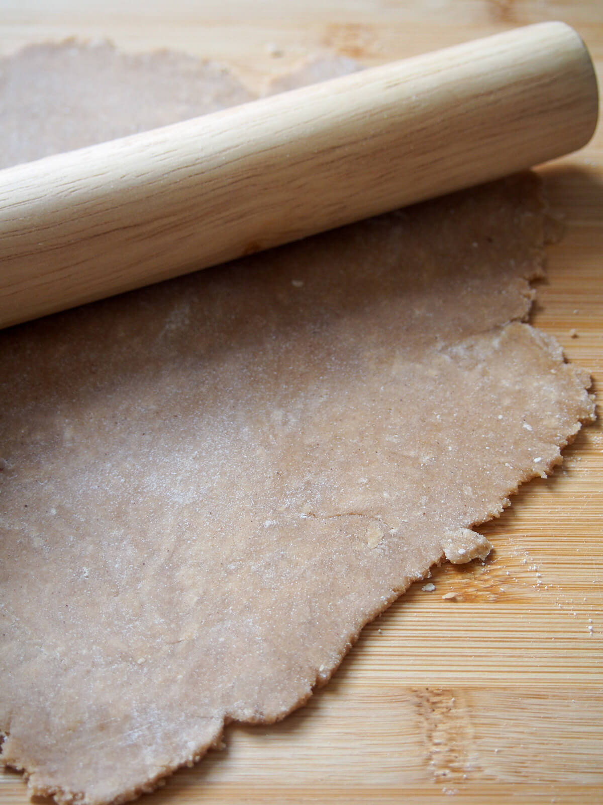 rolling chestnut pasta dough rolling out chestnut pasta dough on chopping board.