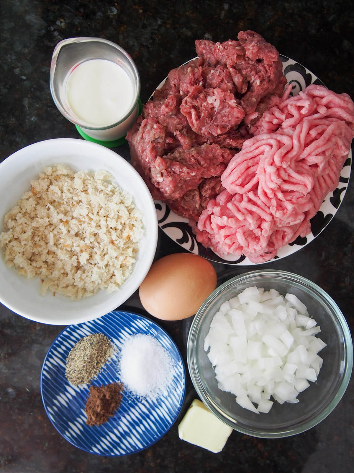 plates with ground meats, breadcrumbs, onion and herbs as well as egg, butter and measure with cream