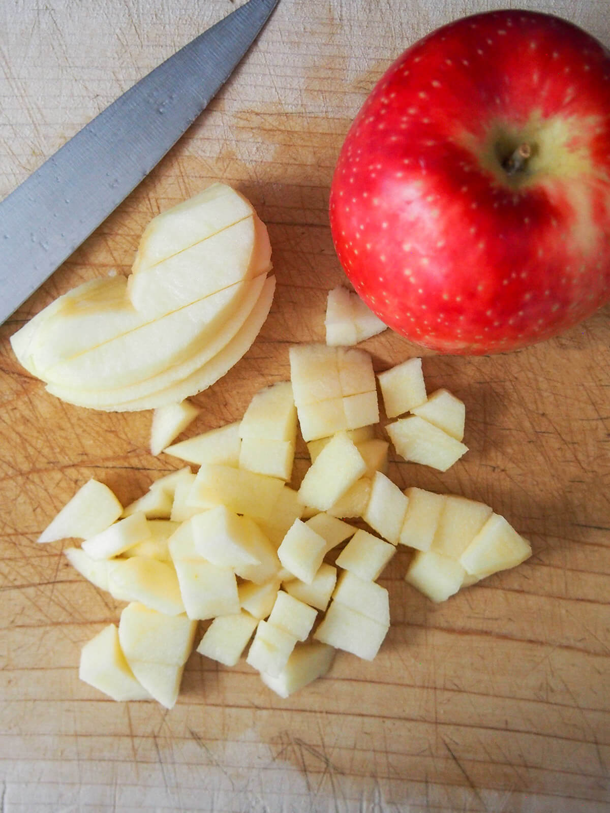 dicing apple with whole apple to side