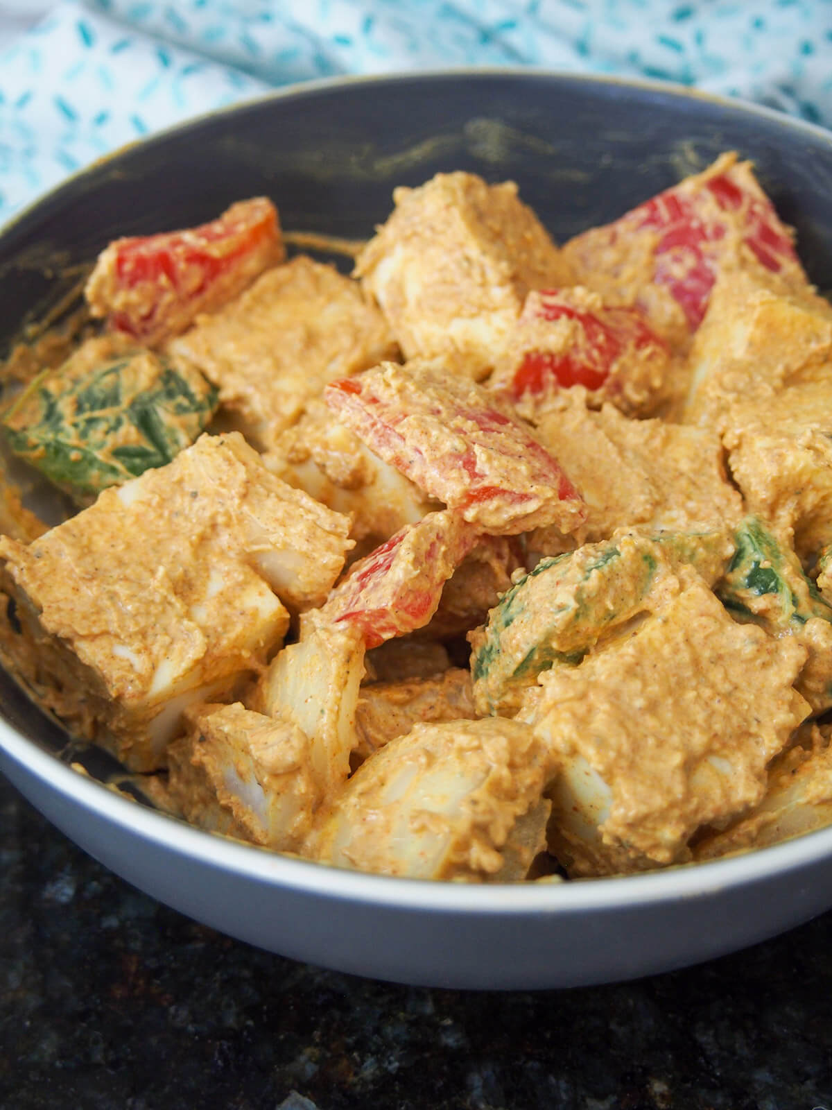 marinating paneer and vegetables for paneer tikka paneer and vegetable pieces in marinade