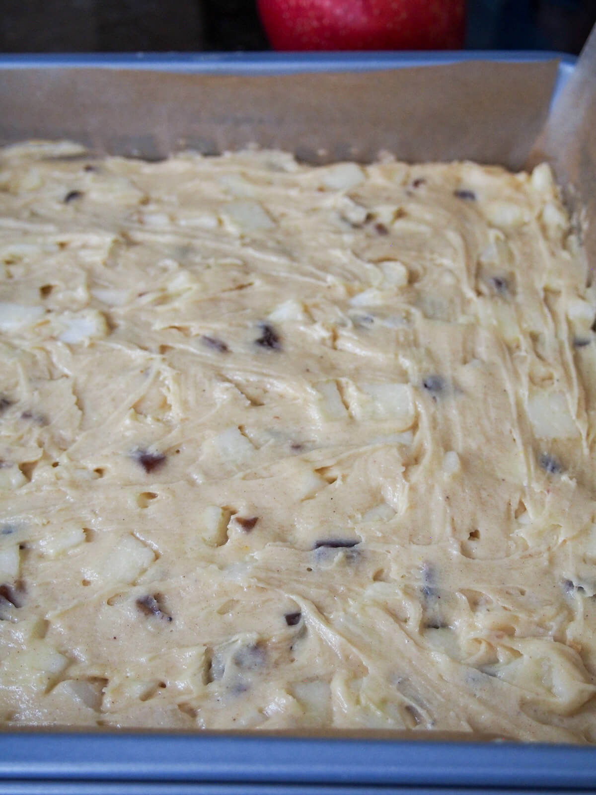 apple snack cake before baking cake mixture in dish before baking