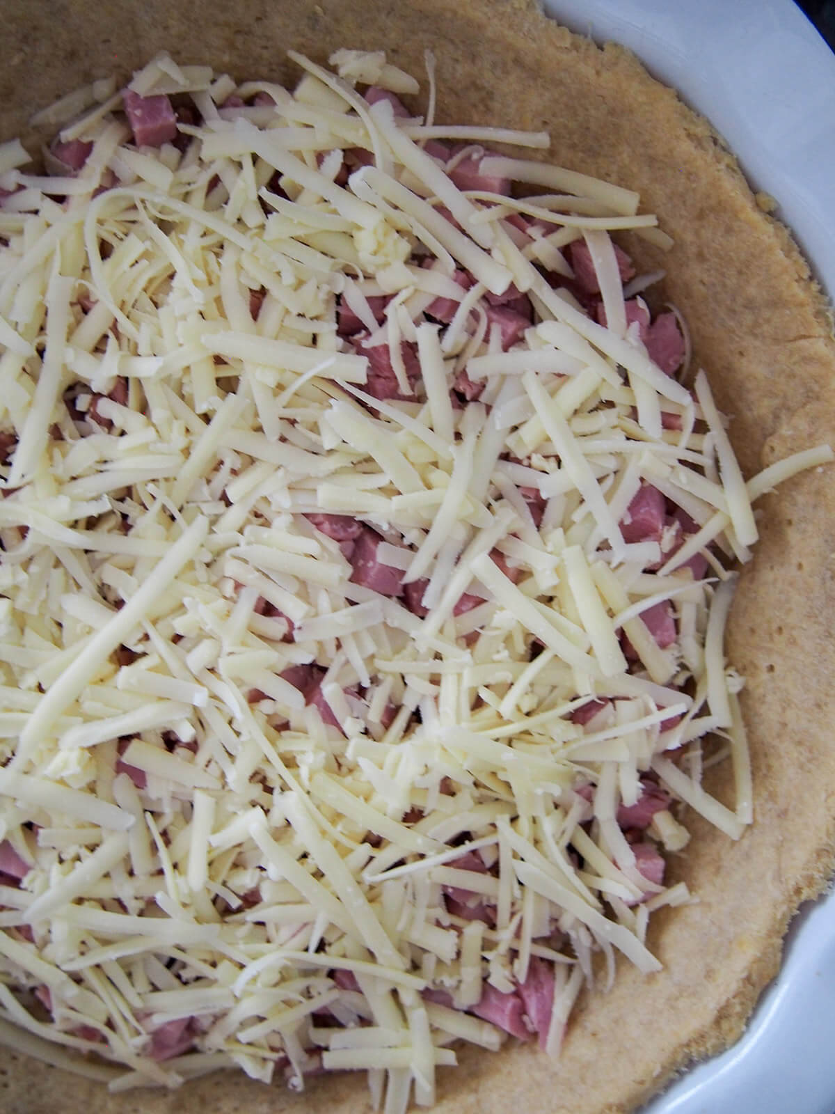 cheese and ham layered inside pie case
