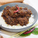 bowl of beef rendang over rice