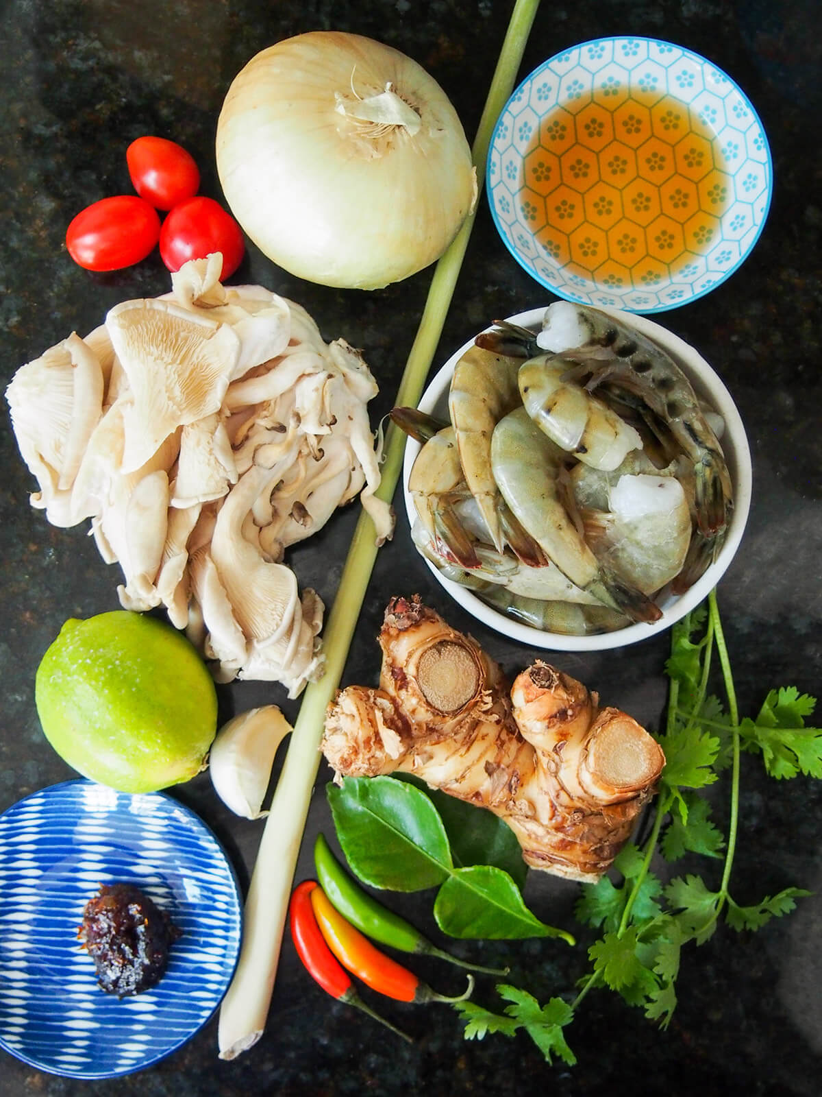 bowls with shrimp, oyster mushrooms, lime, onion and herbs