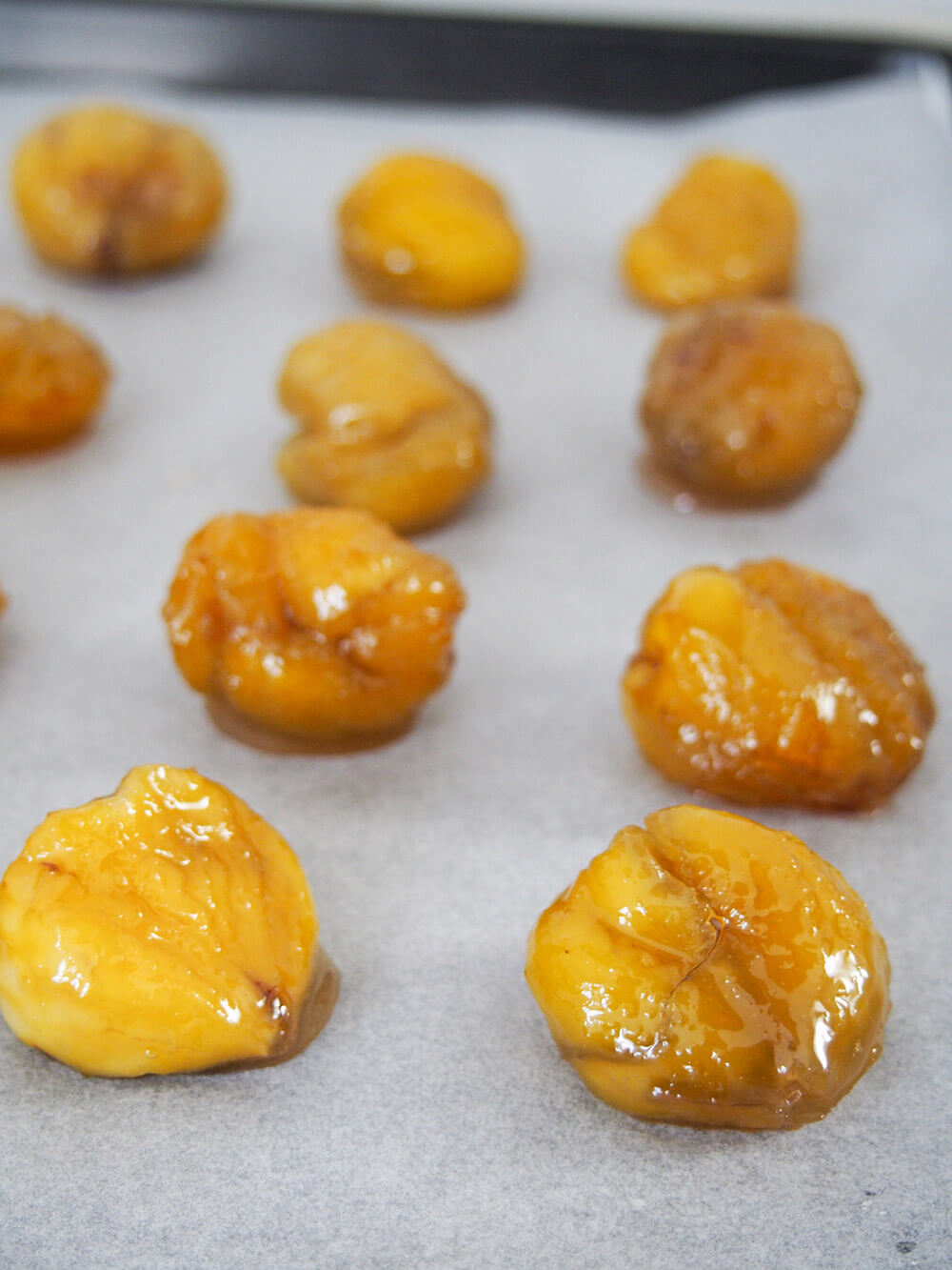 syrup soaked chestnuts on parchment