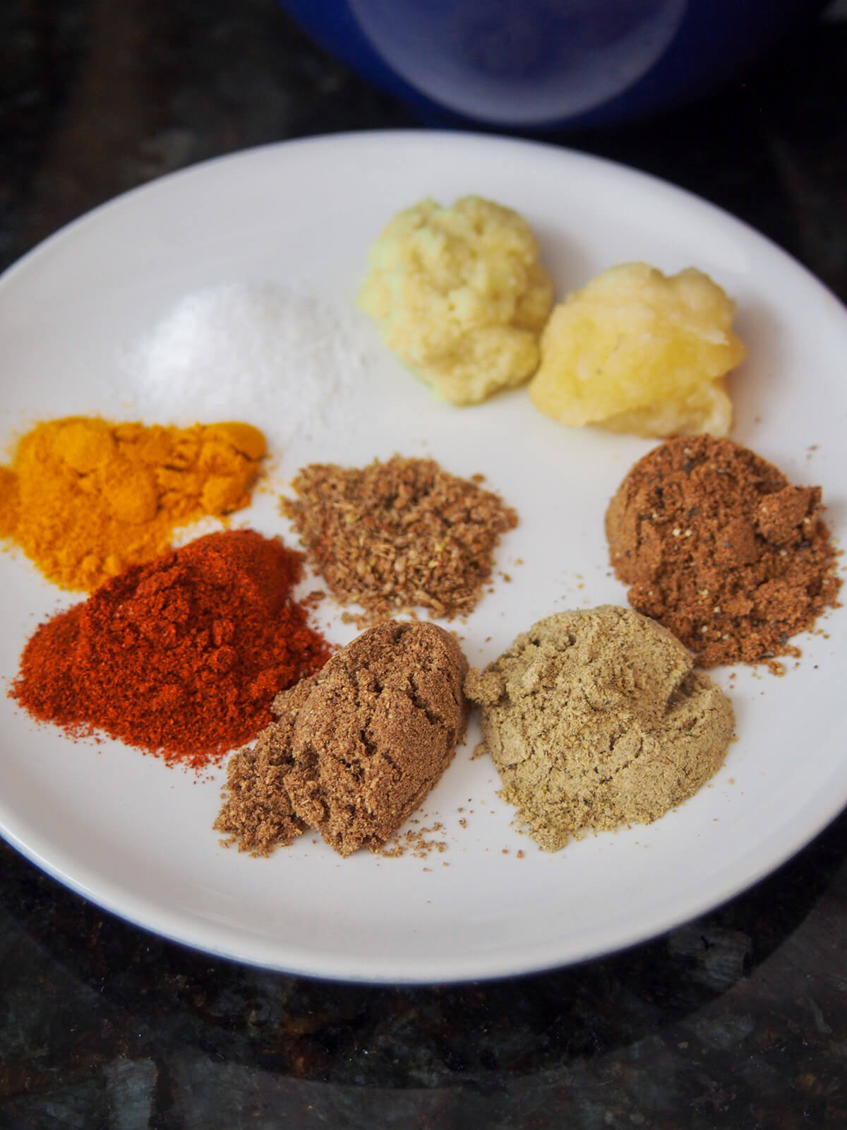 spices for paneer tikka plate with spices on it