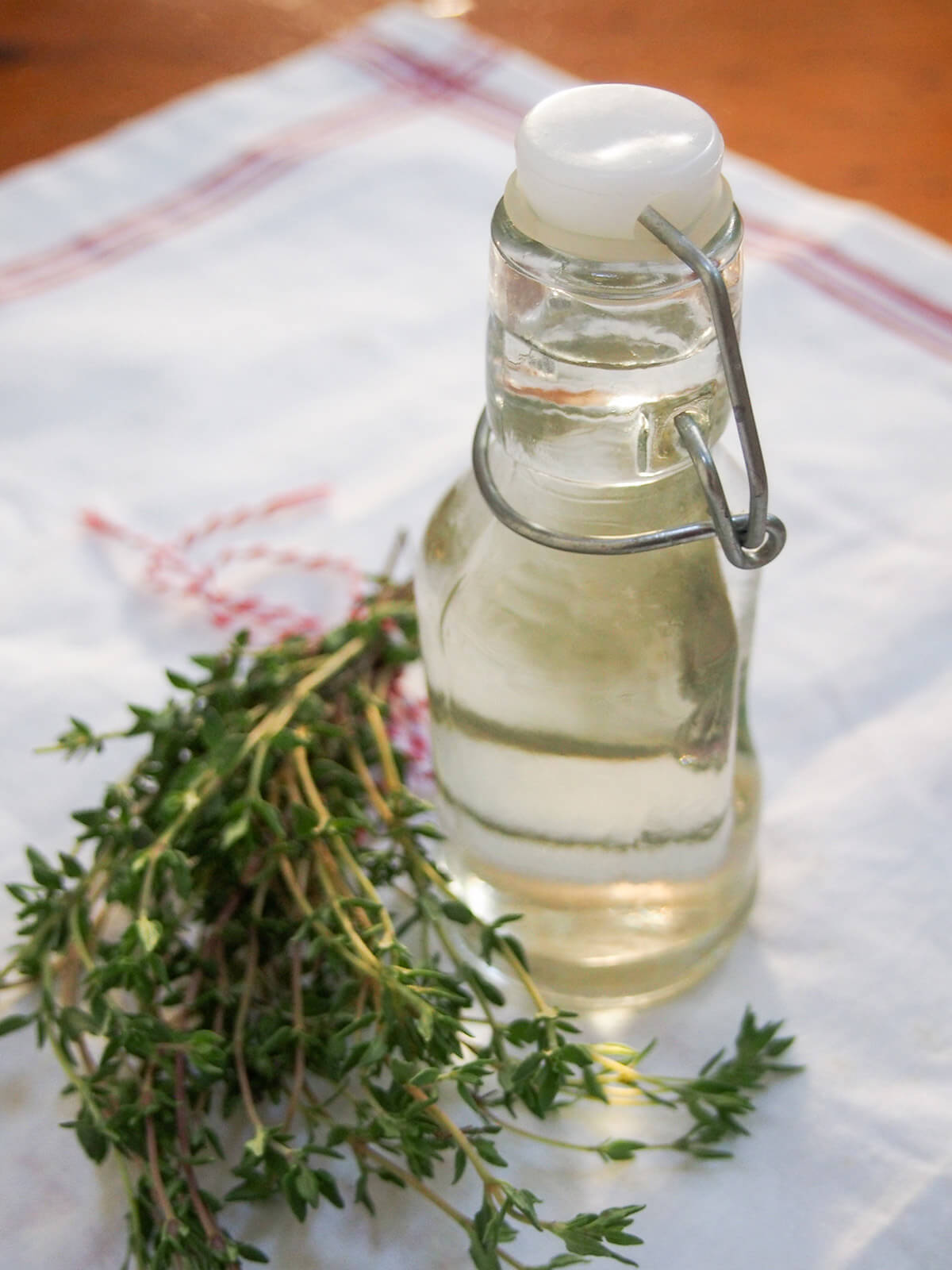 closer view of bottle of thyme simple syrup