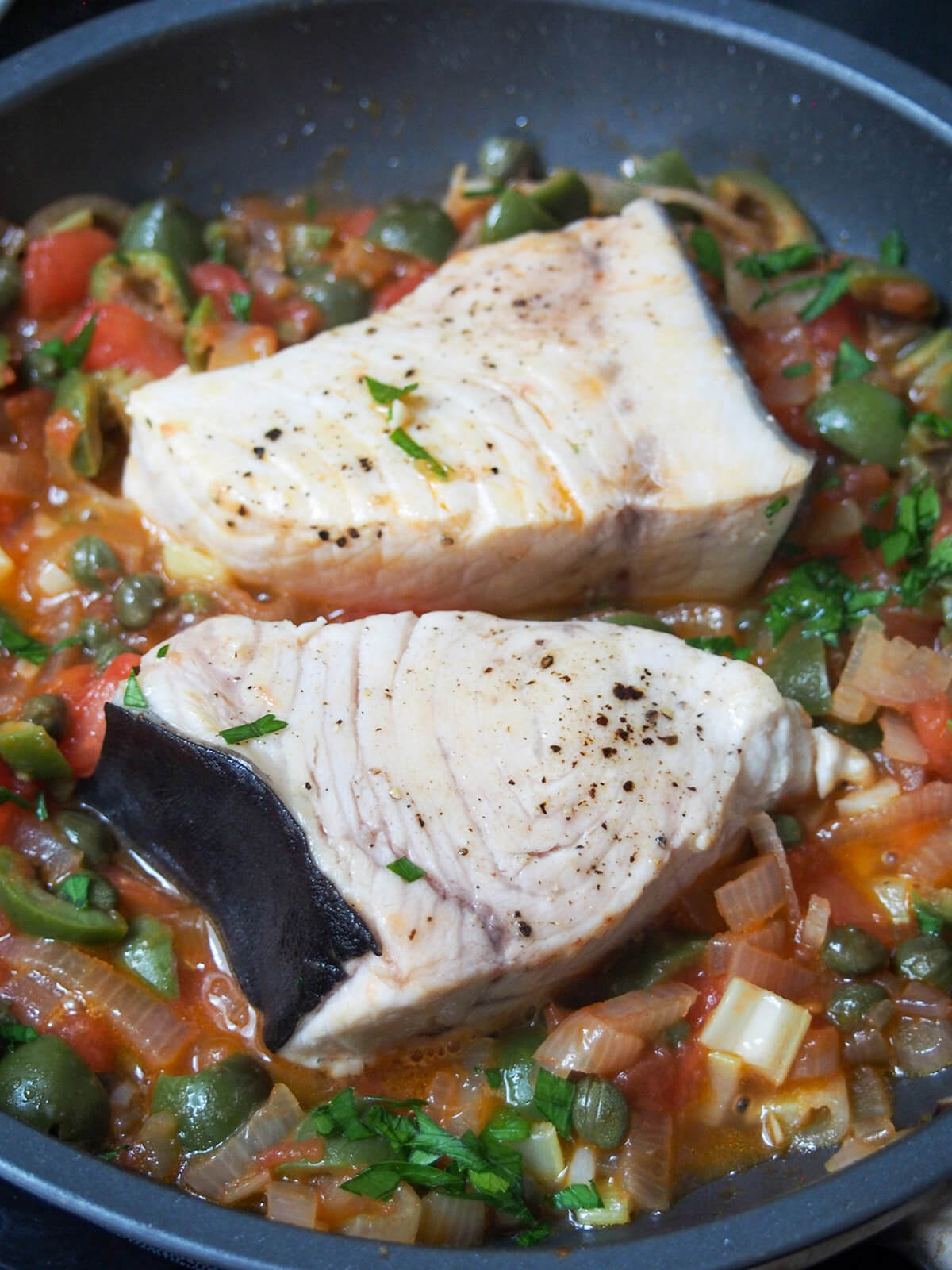 cooking swordfish in tomato caper and olive sauce