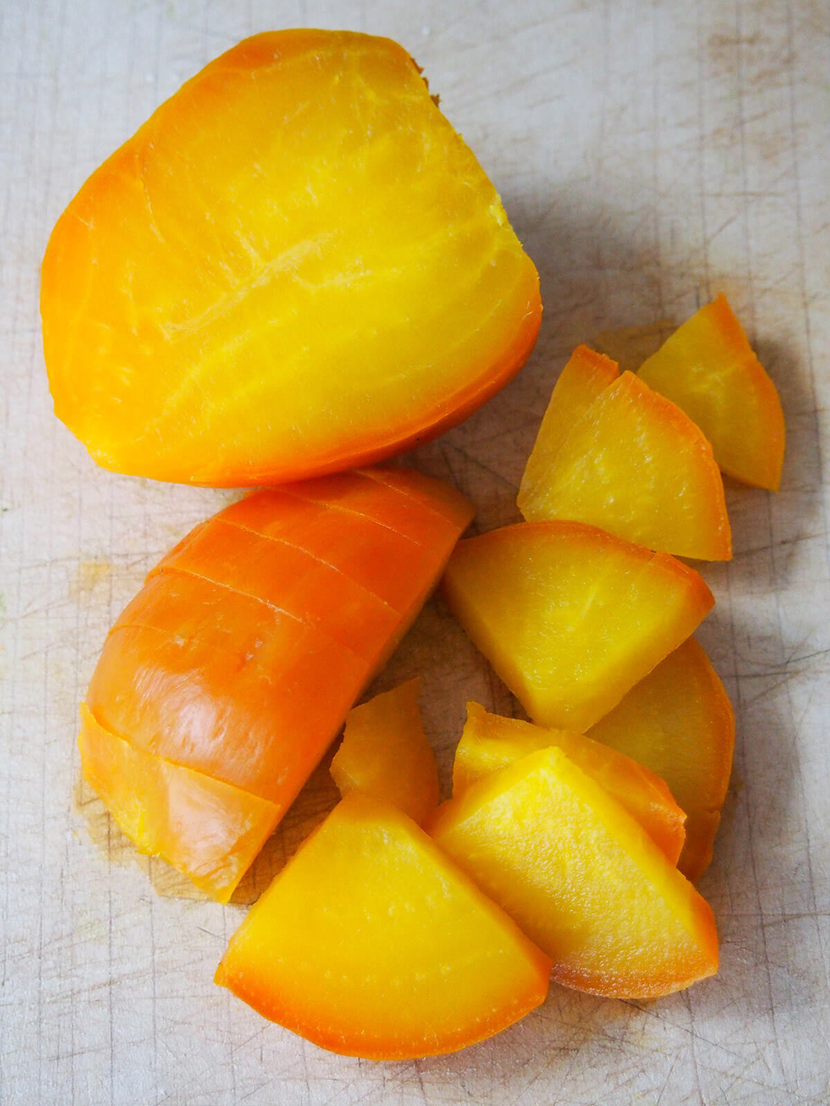 golden beet cut in half with one half in chunks