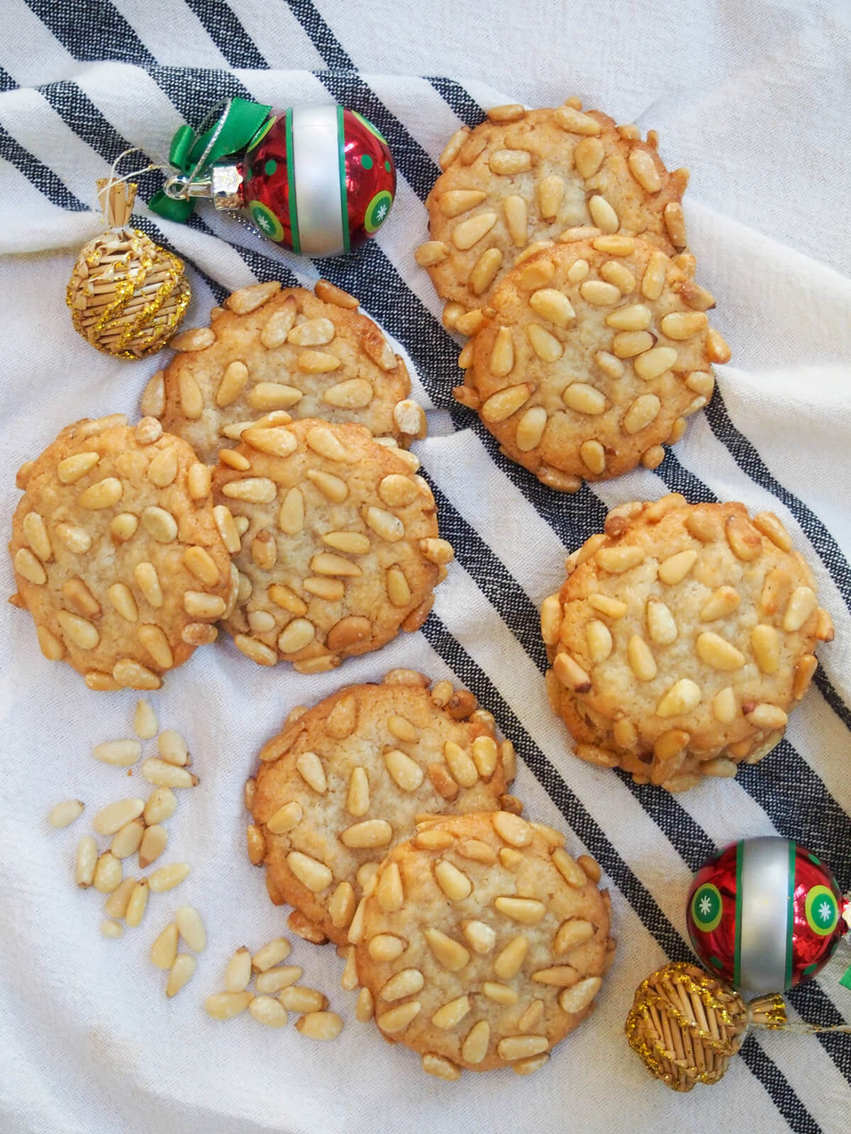 pignoli cookies from overhead with decorations to sides of cookies