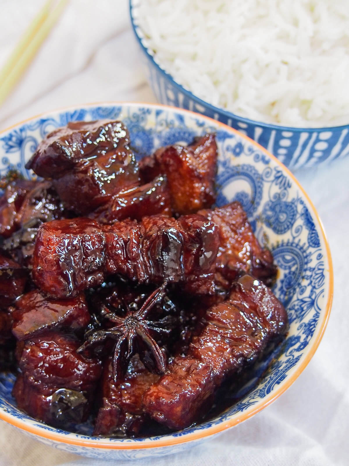 side view of bowl of Hong shao rou red braised pork belly