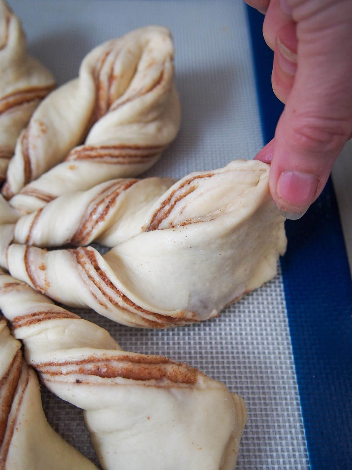 pinching twisted dough to form points