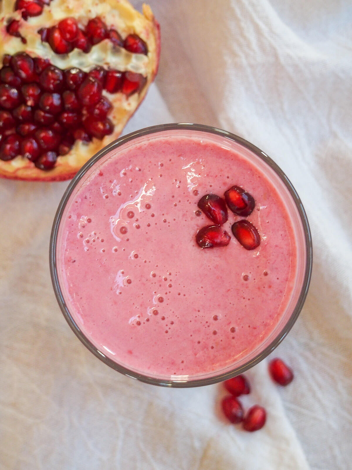 glass of pomegranate smoothie from overhead