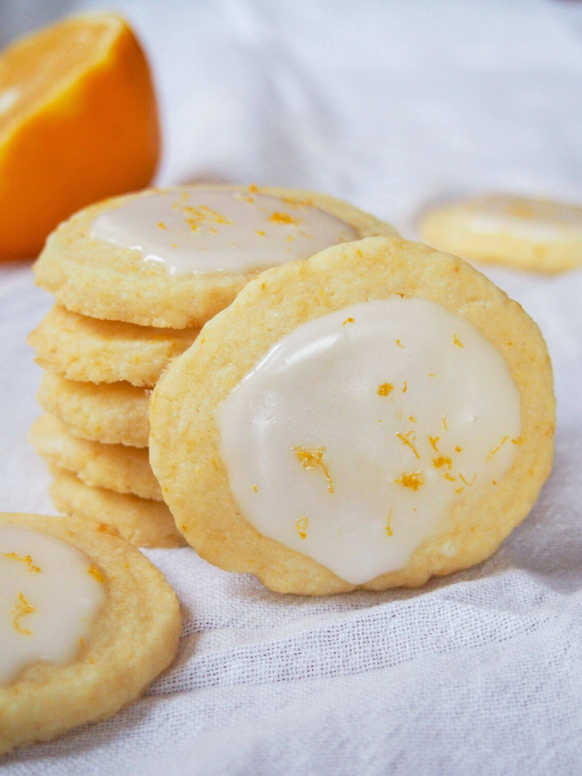 stack of Meyer lemon cookies with one resting in front
