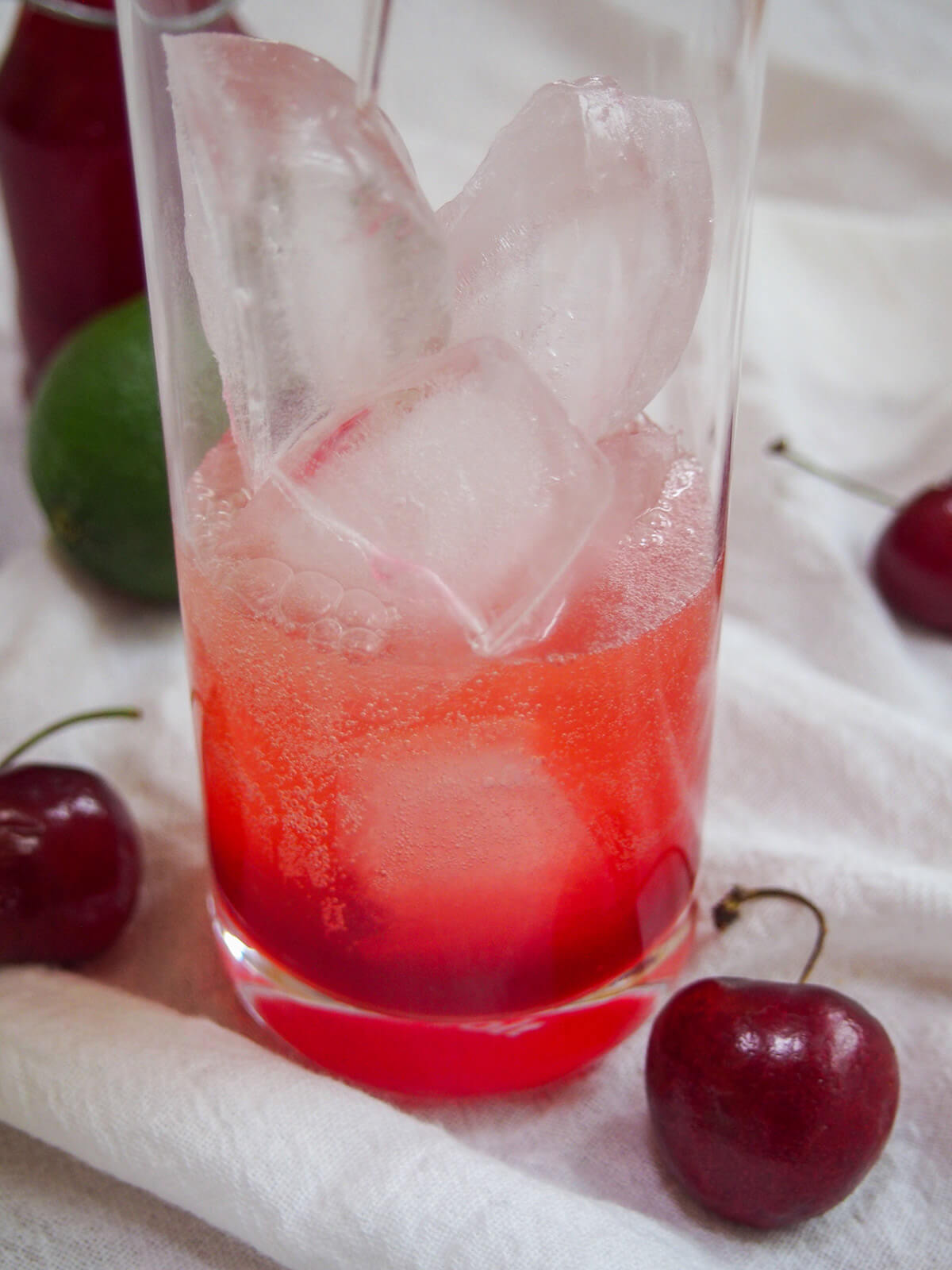 adding ginger ale to glass with ice and grenadine