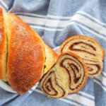 two slices cut from loaf of cozonac