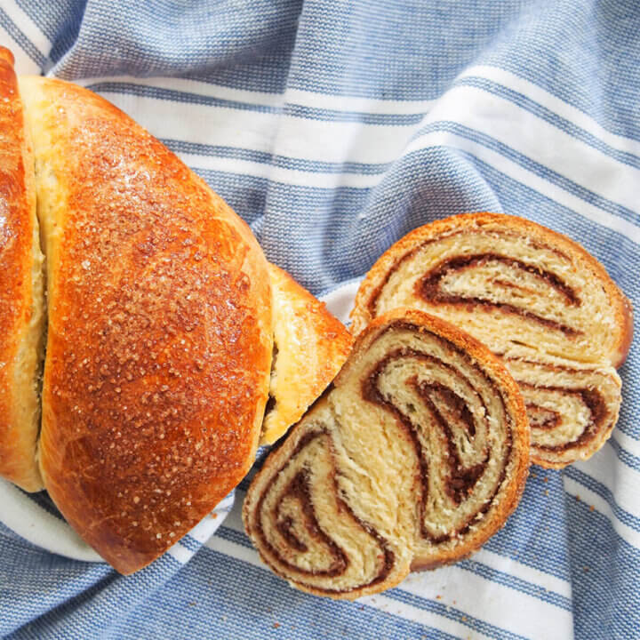 two slices cut from loaf of cozonac