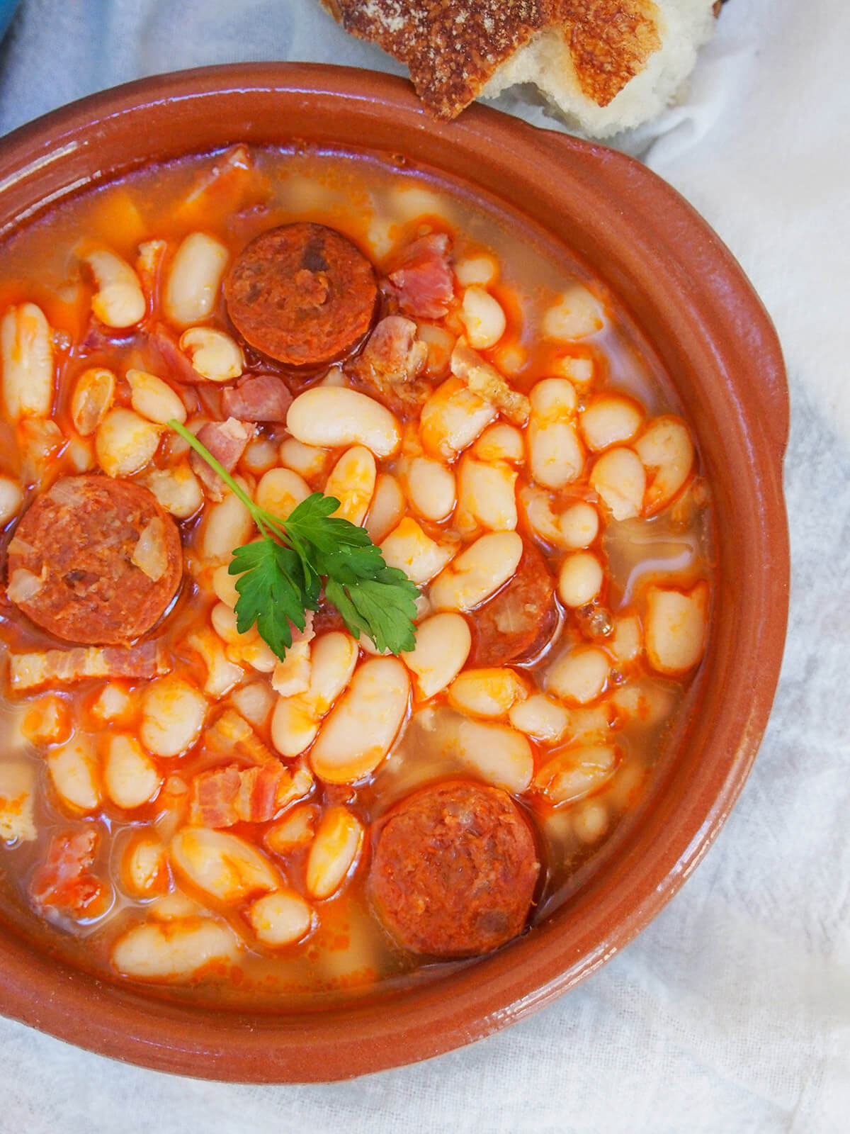 bowl of Spanish pork and bean stew (fabada) from overhead