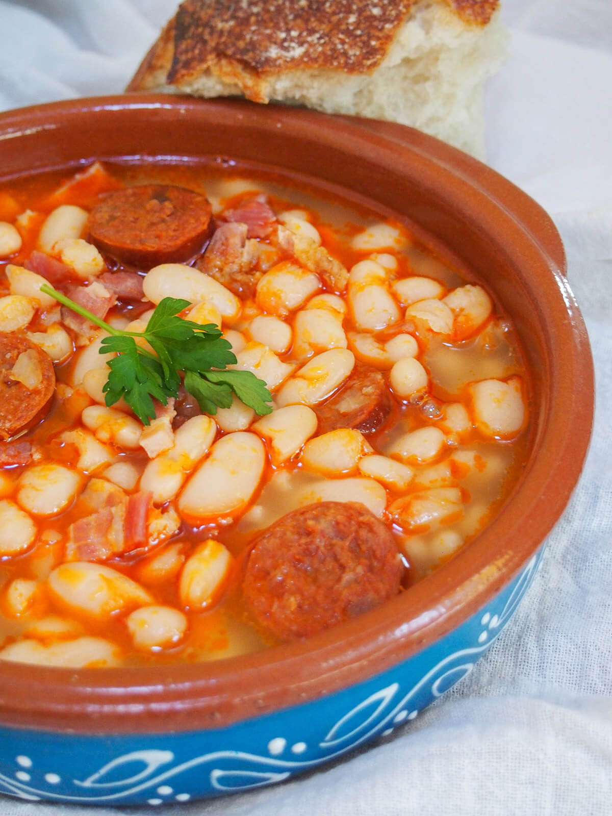 terracotta bowl of fabada Asturiana from side