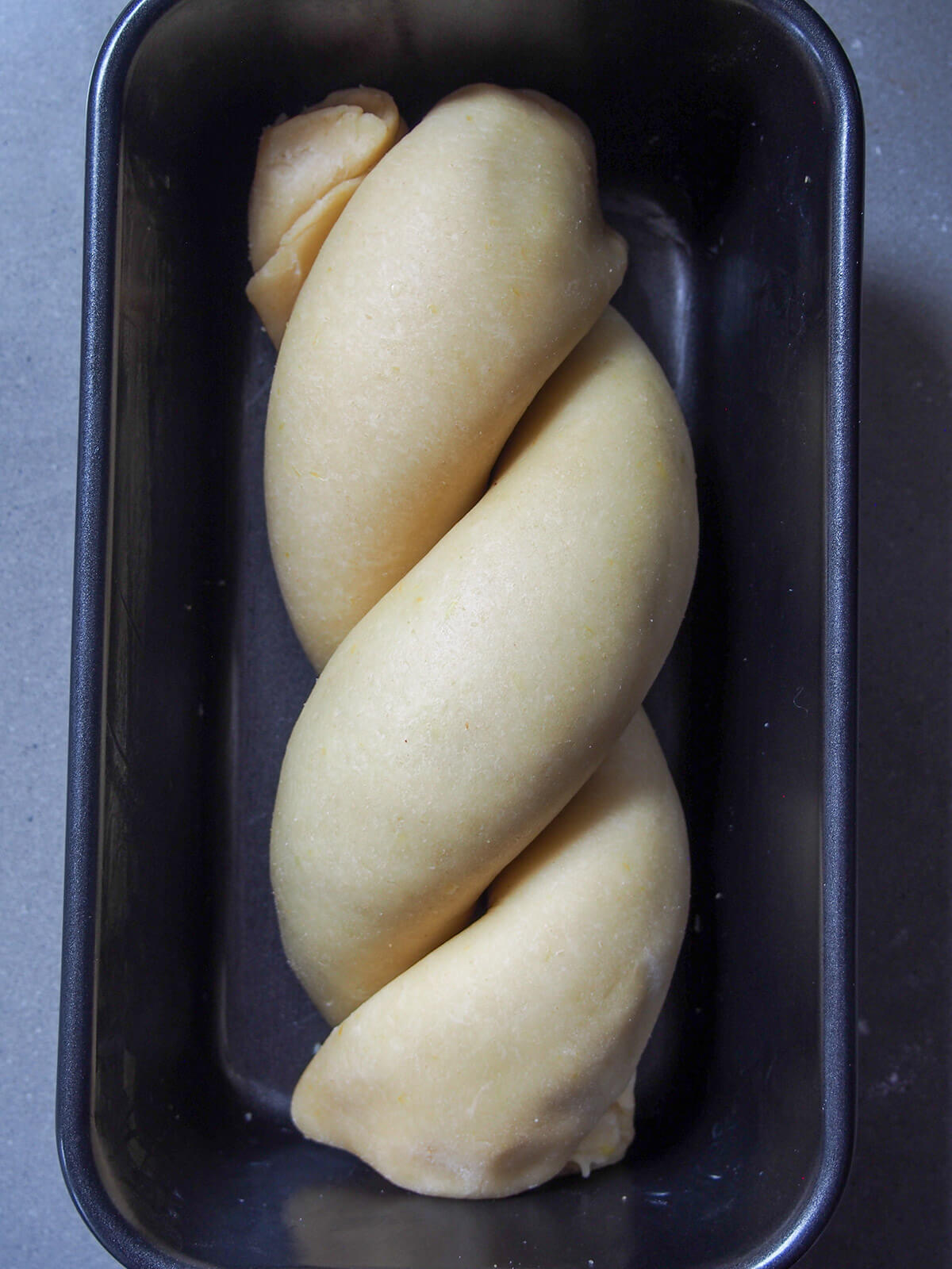 twisted bread in baking tin
