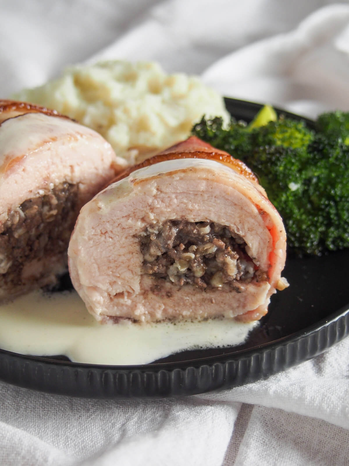 end on view of cut haggis stuffed chicken aka chicken Balmoral