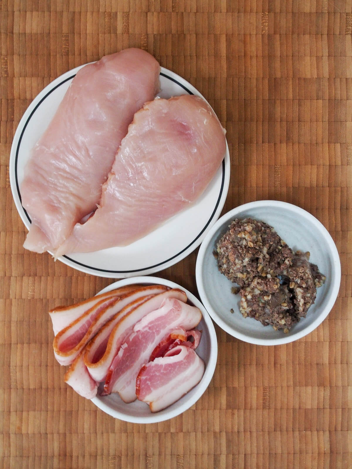 plates with chicken, haggis and bacon