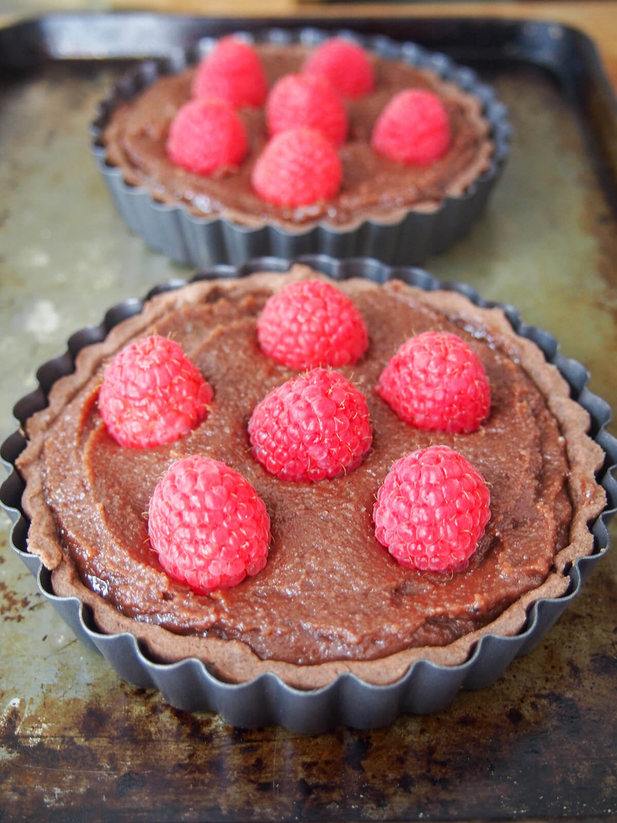 chocolate almond tart with raspberry before baking