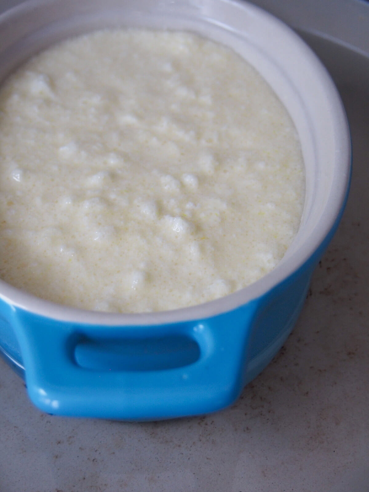 mixture in baking dish sitting in dish of water before baking