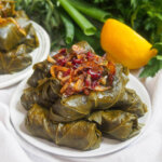 plate of dolmeh barge mo Persian stuffed grape leaves