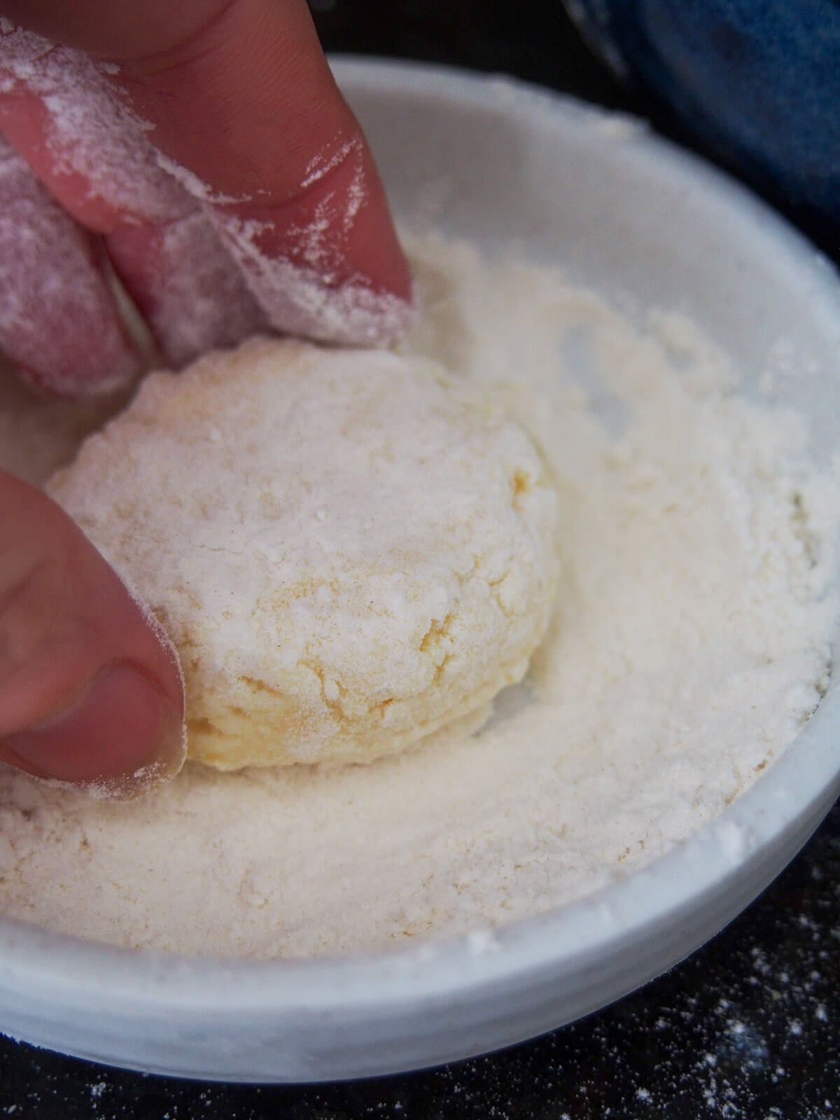 dusting pancake with flour before cooking