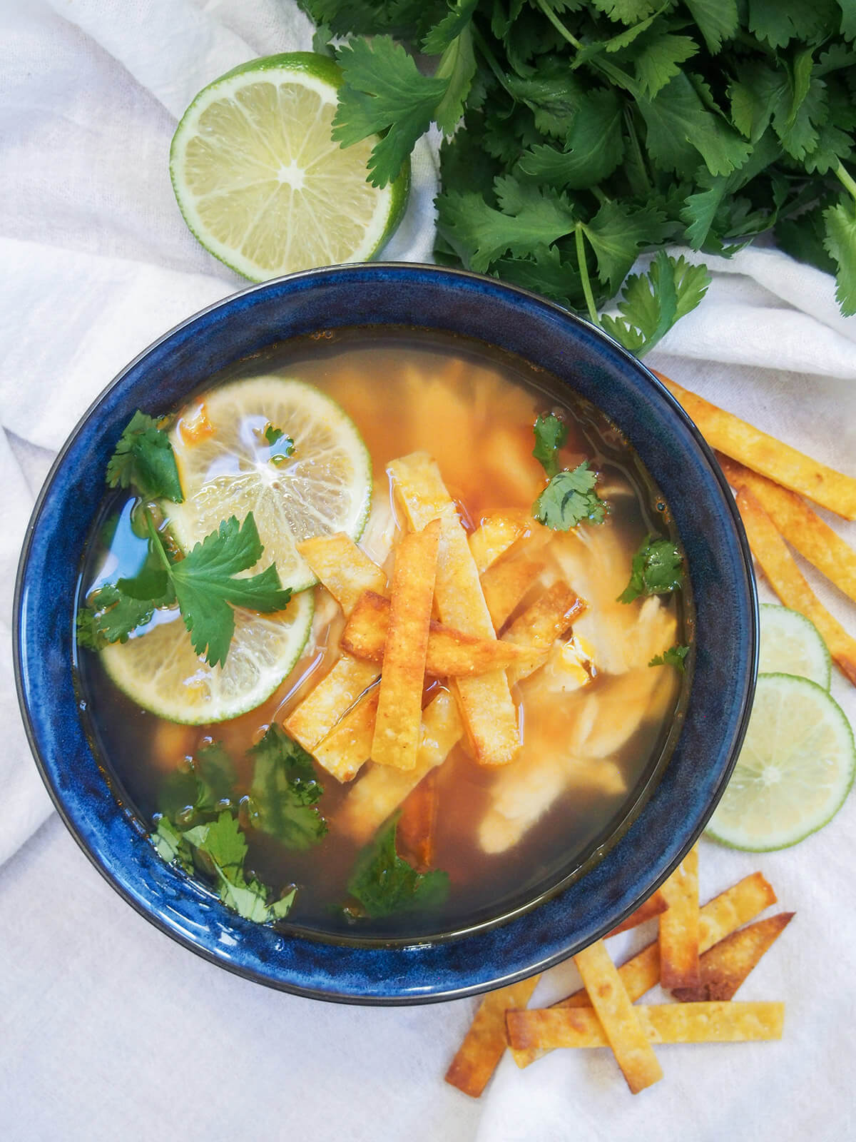 overhead view of bowl of sopa de lima, Mexican lime soup