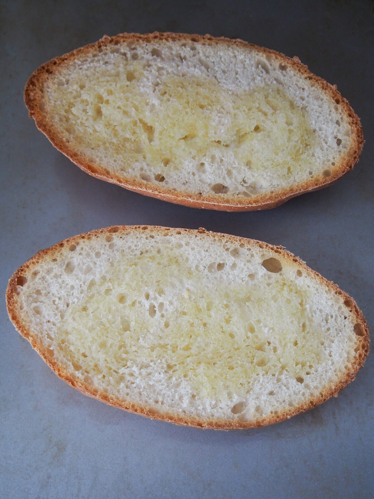 toasted bolillos rolls with melted butter on top