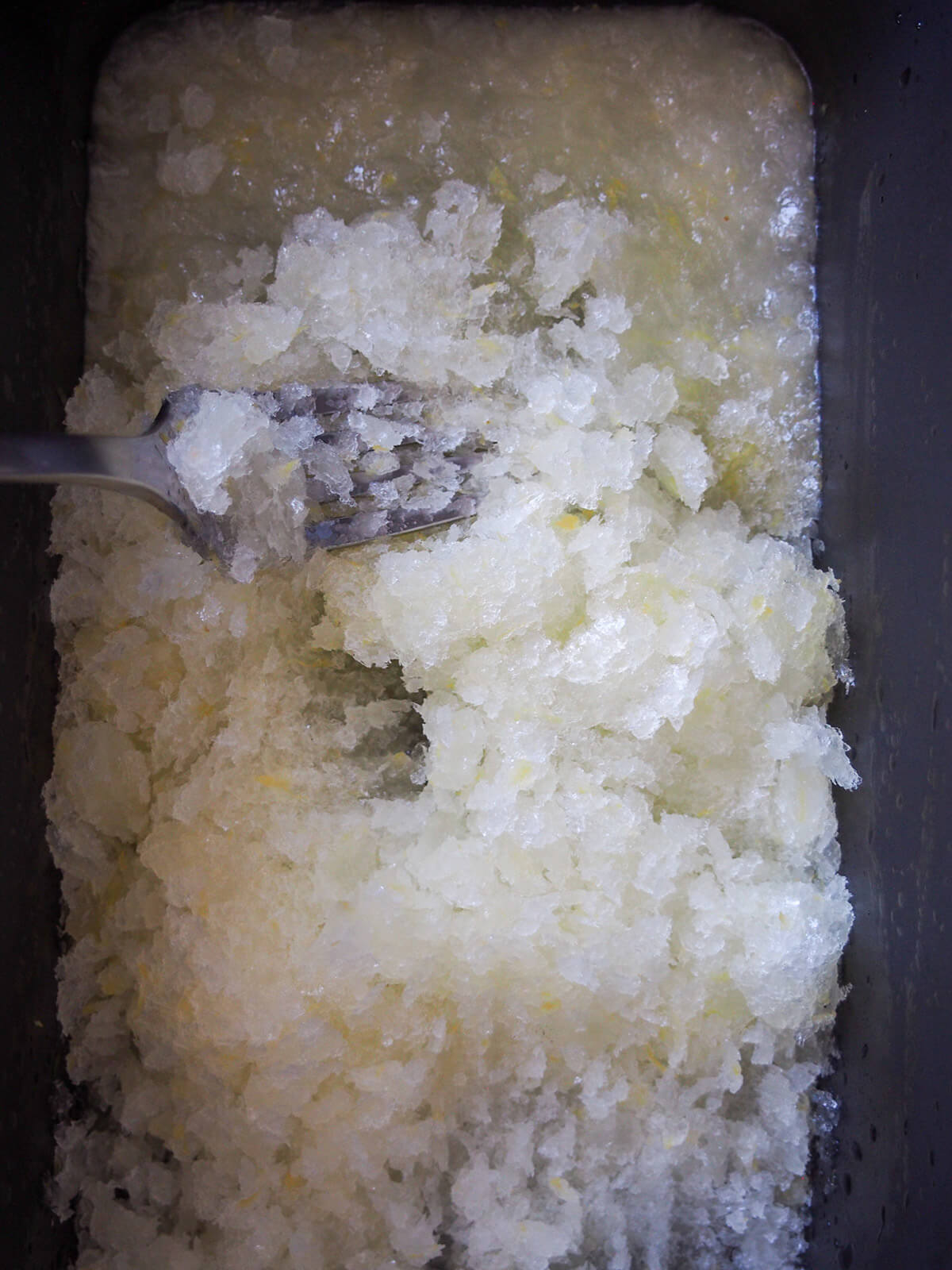 breaking up frozen lemon granita