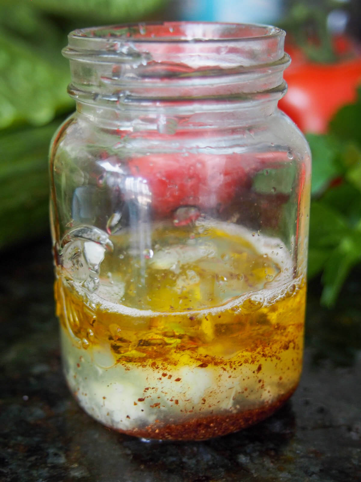 small jar with dressing ingredients in it